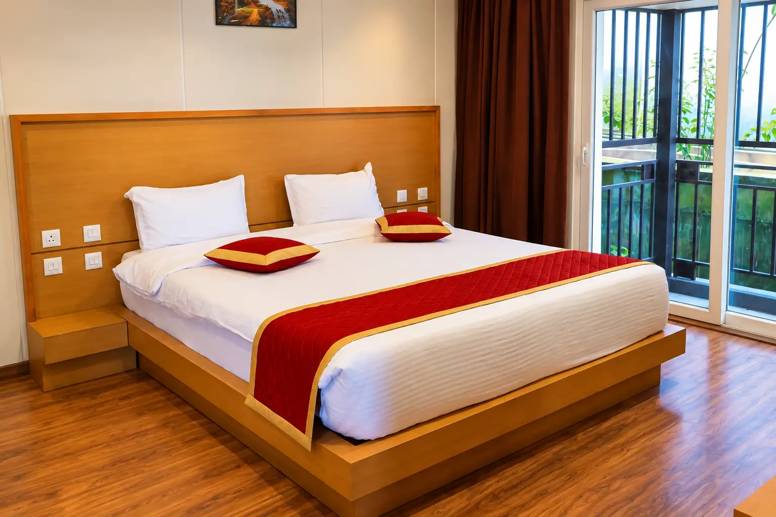 Bright bedroom with a wooden bed and balcony doors